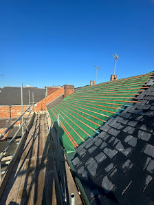 SkyCraft Roofing team working on a professional slate roof installation