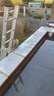 Flat roof parapet detail during installation by SkyCraft Roofing